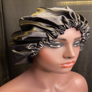 Stretchy Satin bonnet that can be adjusted  to protect your hair and keep hair moisturized at bedtime while you sleep. Also reversible and keeps your healthy hair style in place